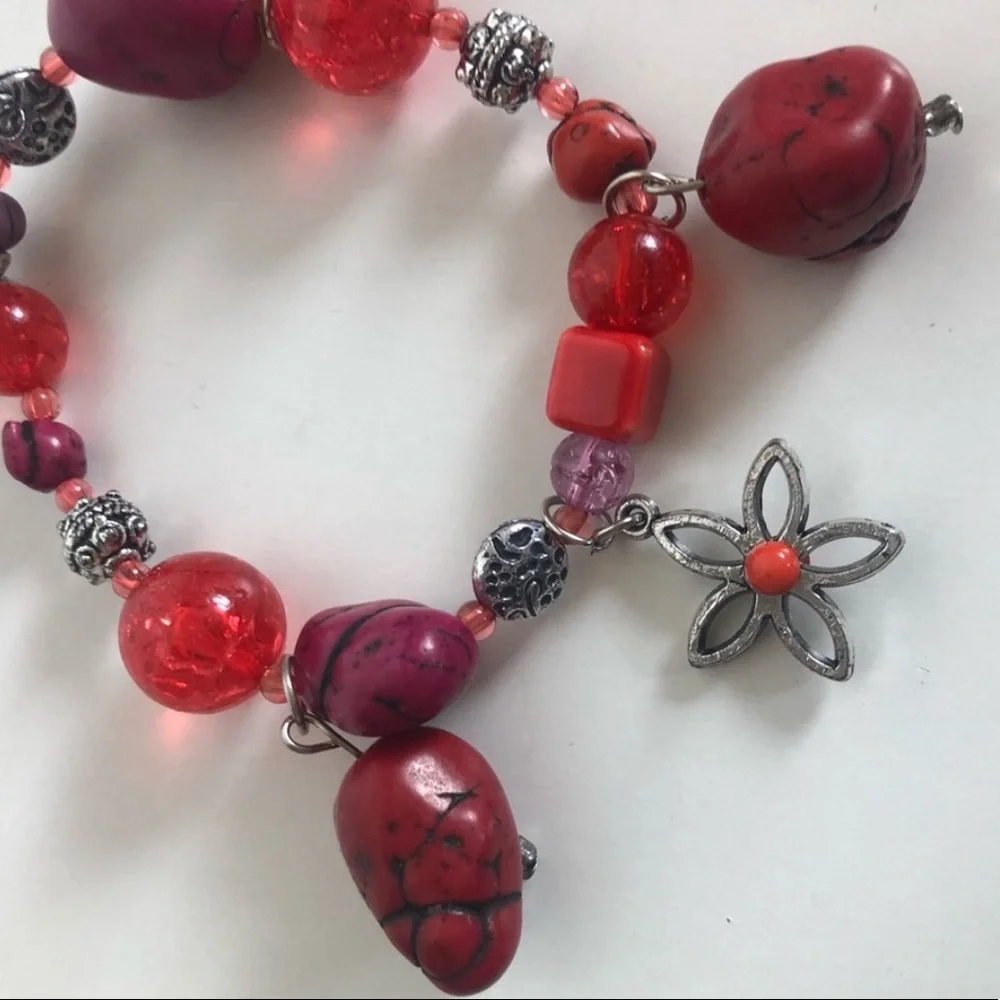 Handcrafted artisan red and burgundy stones paired with silver flowers bracelet